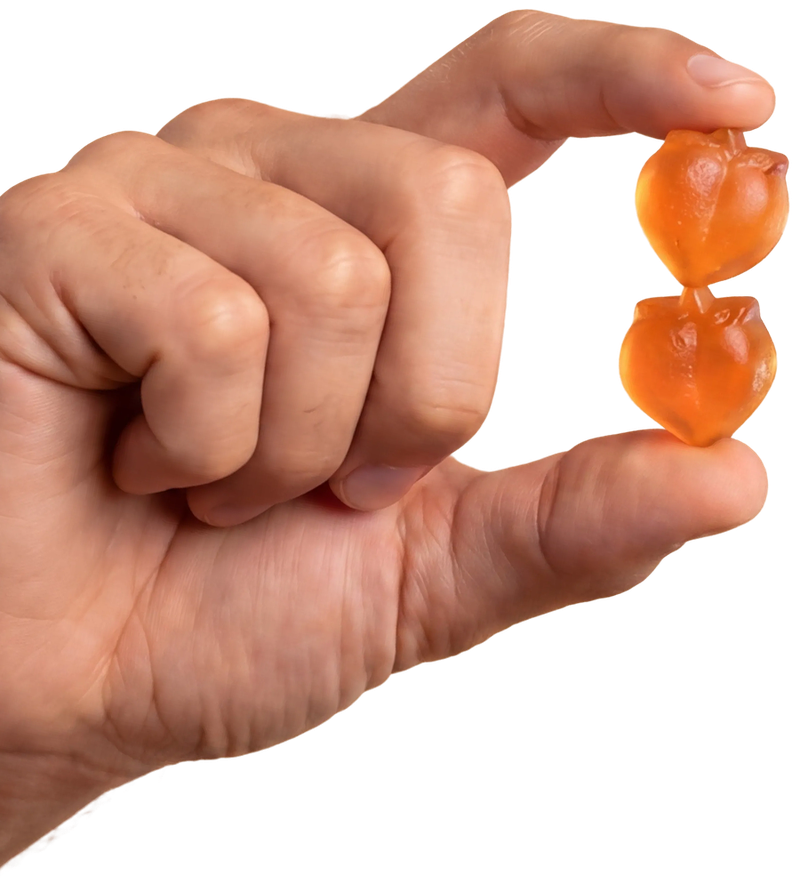 A hand holding two Peachy Clean gummies
