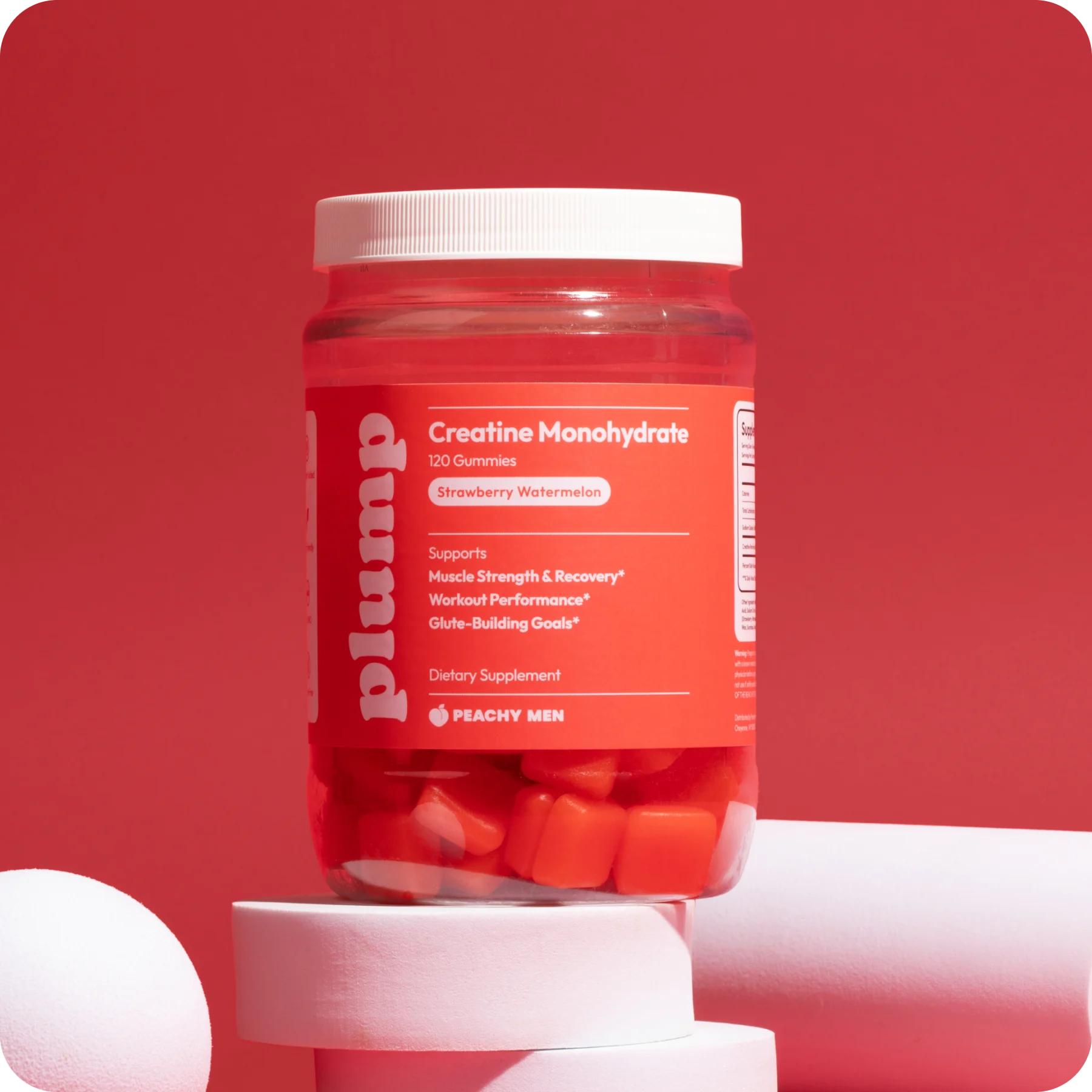 Peachy Plump bottle on a red studio set